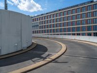 a car is driving on the highway through an underground parking garage area in a city