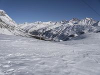 Europe Winter: A Valley Surrounded by Mountains and Clear Skies