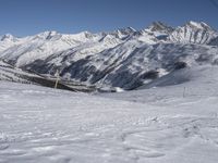 Europe Winter: A Valley Surrounded by Mountains and Clear Skies