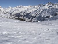 Europe Winter: A Valley Surrounded by Mountains and Clear Skies