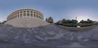 a fish eye view of the top of a building that is circularly shaped in half