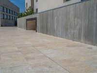 European Architecture: Concrete Wall and Paver Plaza