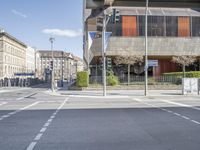 a empty street in the middle of city with no traffic cones and signs in the middle of it