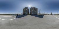 360 spherical image of a building in a parking lot with roped off driveways around