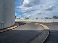 a car is driving on the highway through an underground parking garage area in a city