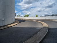 a car is driving on the highway through an underground parking garage area in a city