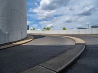 a car is driving on the highway through an underground parking garage area in a city