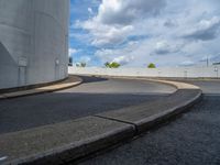 a car is driving on the highway through an underground parking garage area in a city