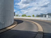 a car is driving on the highway through an underground parking garage area in a city