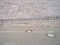 European City Life: Brick Wall in an Urban Public Space