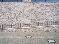 European City Life: Brick Wall in an Urban Public Space