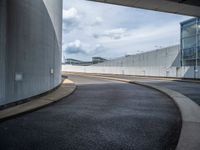 a car is driving on the highway through an underground parking garage area in a city