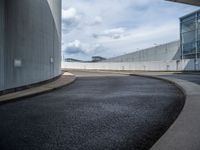 a car is driving on the highway through an underground parking garage area in a city