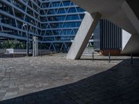 the building has several different angles on it, in varying colors and shapes with brick and concrete floors