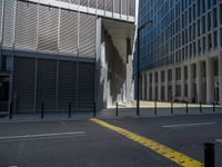 the empty street with bicycles parked in front of the buildings has a sign that says the library on it