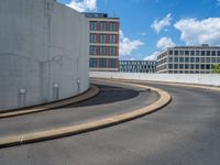 a car is driving on the highway through an underground parking garage area in a city