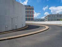 a car is driving on the highway through an underground parking garage area in a city