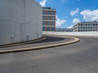 a car is driving on the highway through an underground parking garage area in a city