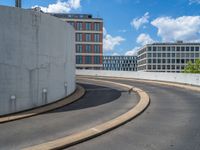 a car is driving on the highway through an underground parking garage area in a city