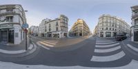 a photo taken using 360 - pan lens to see the surrounding view of a street