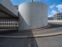 a car is driving on the highway through an underground parking garage area in a city