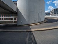 a car is driving on the highway through an underground parking garage area in a city