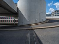 a car is driving on the highway through an underground parking garage area in a city