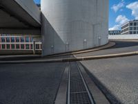 a car is driving on the highway through an underground parking garage area in a city