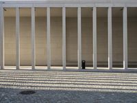 the columns and pillars are designed to form a line with an opening on each side