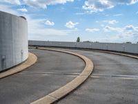 a car is driving on the highway through an underground parking garage area in a city