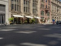 pedestrians and cars are driving down the street in a european city square at sunset - style