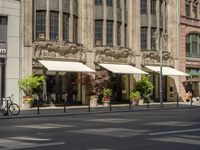 pedestrians and cars are driving down the street in a european city square at sunset - style