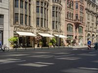 pedestrians and cars are driving down the street in a european city square at sunset - style