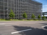 the exterior of a large office building with a lot of windows on each side of the building