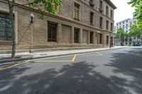 the side walk and walkway of a building is marked with markings for parking spaces below