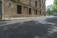 the side walk and walkway of a building is marked with markings for parking spaces below