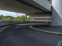 a car is driving on the highway through an underground parking garage area in a city