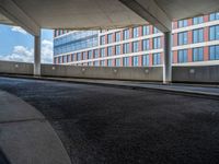 a car is driving on the highway through an underground parking garage area in a city