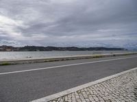 European Coastal Road Under a Grey Sky