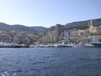 European Coastal Town Cityscape with Mountains and Ocean