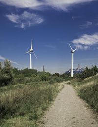 European Landscape: Windmill by the River in Coastal Germany