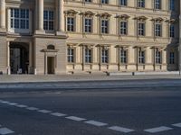 two lanes that appear to be in the middle of the road, and are straight lines to the left