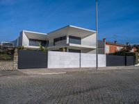 this large house has two terraces that surround it and the garage is closed to the street