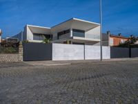 this large house has two terraces that surround it and the garage is closed to the street