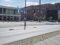 there is a street view with a traffic signal and many buildings in the background outside