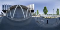 a photo of an outdoor skate park with a ramp on each side of the ramps