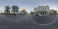 a double lens view of a city intersection at sunset, with cars and pedestrians crossing the road