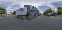 an upside down picture of a building on the side of a road in front of buildings