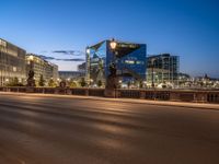 the city skyline is at night from the street level with traffic and pedestrians walking on it