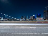 an evening view shows a city and its light trails down the street, with a bike lane to the left